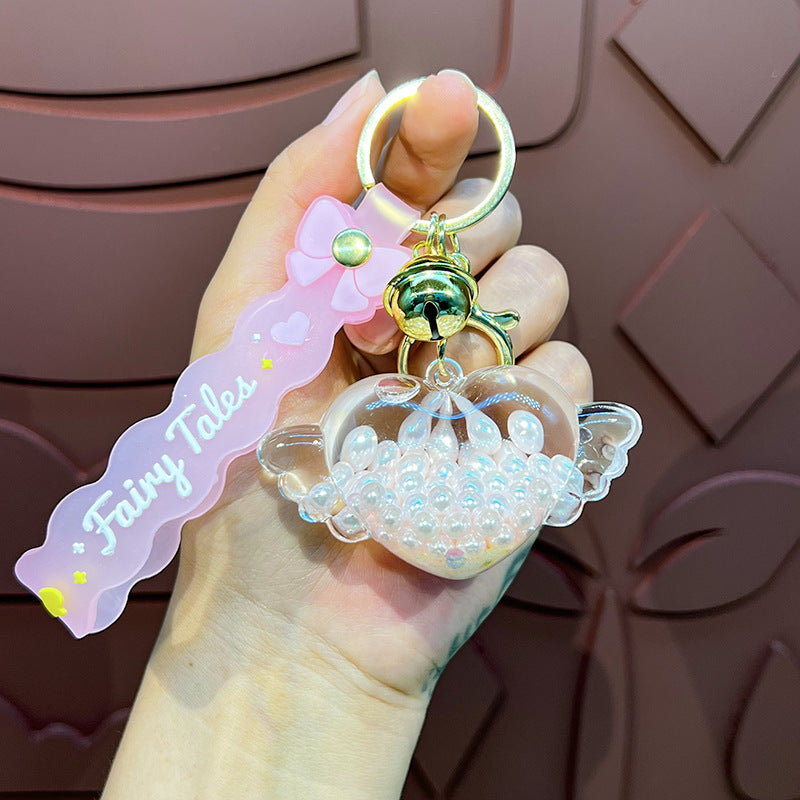 Wholesale Oil-infused Golden Bean Wing Heart Keychain